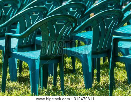 Bucharest, Romania - June 23, 2019: Green Plastic Chairs Are Placed In Izvor Park For Spectators Who