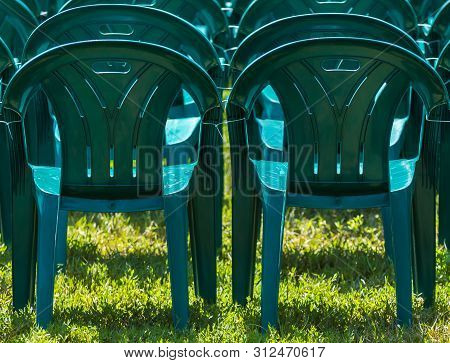 Bucharest, Romania - June 23, 2019: Green Plastic Chairs Are Placed In Izvor Park For Spectators Who