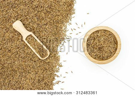 Lot Of Whole Dry Caraway Fruits In A Wooden Bowl With Wooden Scoop Flatlay Isolated On White Backgro