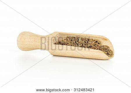 Lot Of Whole Dry Caraway Fruits With Wooden Scoop Isolated On White Background