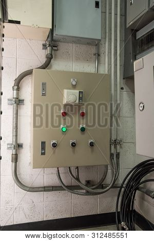 Metal Electricity Control Box With Sign On The Wall