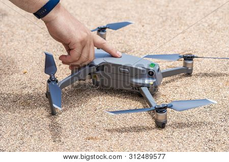 Male Hand Presses The Button To Launch The Drone For Flight, Close-up