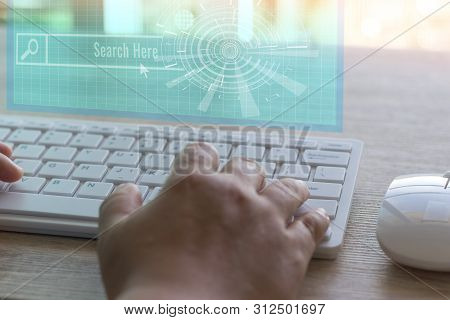 Dry Hands Of Adult Student Using White Keyboard And Virtual Screen On Wood Table To Searching Knowle