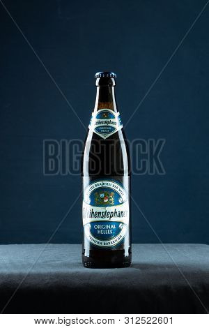 Khabarovsk, Russia - Jul 21, 2018: Beer Bottle Weihenstephan On Table On Blue Background