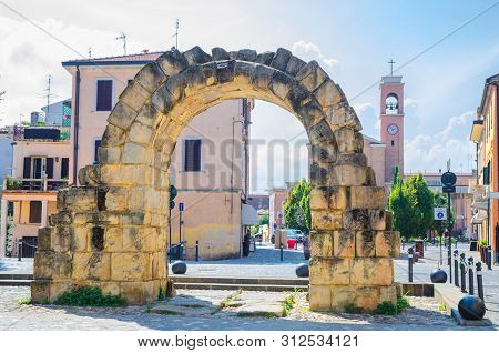 Ruins Of Ancient Stone Arch Porta Montanara Gate And Parrocchia Di San Gaudenzo Church In Old Histor