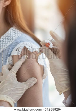 Immunization And Vaccination For Polio, Flu Shot, Influenza Or Hpv Prevention With Woman Having Vacc