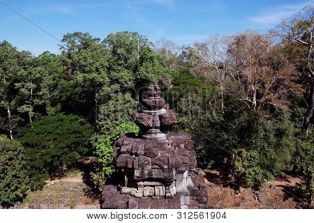 Ancient Stone Tower In The Forest. The Object Of Architectural Art Of Medieval Southeast Asia. Stone