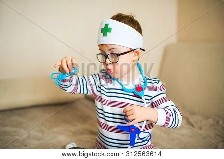 Little Ginger Boy With Glasses With Syndrome Dawn