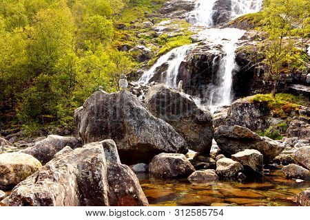 Ryfylke Waterfall At Svandalsfossen In Norway, Powerful Waterfall In Norwegian Mountains. National T