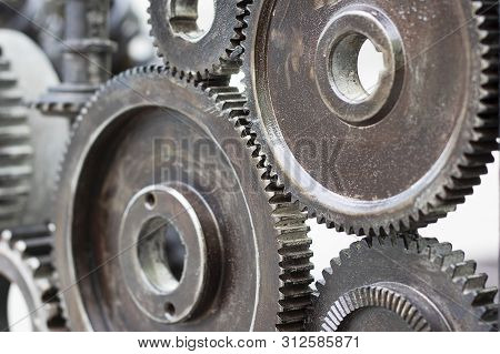 Iron Gears Convey Traction. Round Gears Work. Large Equipment Driven Machine.