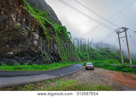 Vehicles Moving Towards The Hills Station Area At Vagamon