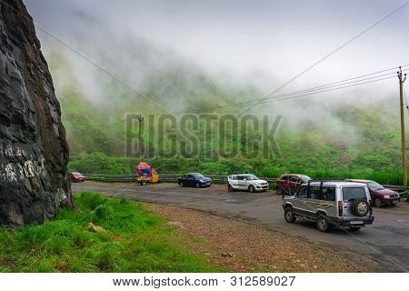 Vehicles Moving Towards The Hills Station Area At Vagamon