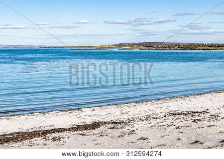 Beach In Kilronan With Inishmann In Background