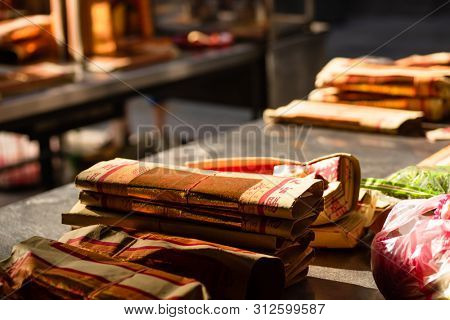 Yunlin, Taiwan - July 13th, 2019: chinese joss gold paper craft on a table at Beigang Chaotian Temple, Yunlin, Taiwan, Asia
