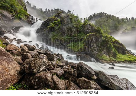 Latefoss Waterfalls Streams With Stones In The Foreground, Odda, Hordaland County, Norway