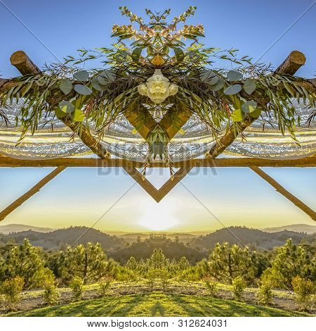 Chuppah Refleced In Half At A Jewish Wedding With Sunset Behind