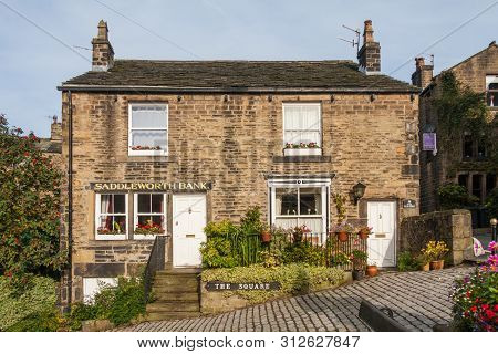 Dobcross, Oldham, England - September 21st 2010: Old Stone Houses In The Square. One House Was Forme
