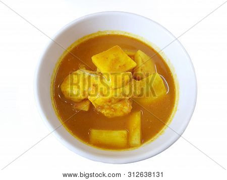 Thai Food Style,top View Sour Soup With Snapper And Young Coconut Shoots In White Bowl Isolated On W