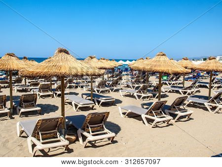 Malia, Crete, Greece - Juni 18, 2019: Sunbeds At The Beach In Malia On Crete, Greece