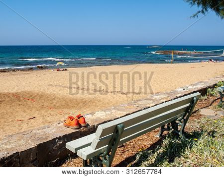 Malia, Crete, Greece - Juni 18, 2019:  View Of Sandy Beach In Malia On Crete, Greece