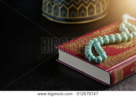 Islamic Book Koran With Rosary Beads And Kopiah Hat For Muslims