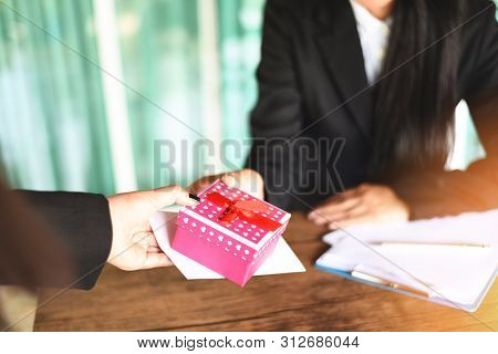 Asian Business Woman Receiving Salary Bonus Money And Gift Box From Boss Or Manager At Office Happil