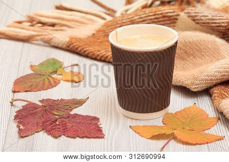 Cup Of Coffee, Checkered Plaid And Dry Leaves On Gray Wooden Boards. An Autumn Still Llife.