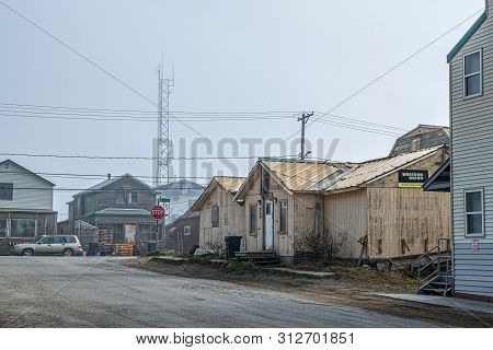 Nome, Alaska - June 10: The Knom Radio Tower With A Star On Top Overlooks The Old Run Down Homes As 