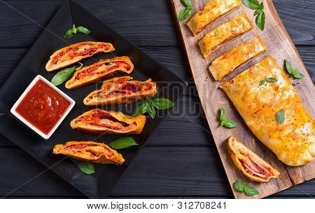 Pizza Roll Stromboli With Cheese Salami Olives And Tomatoes