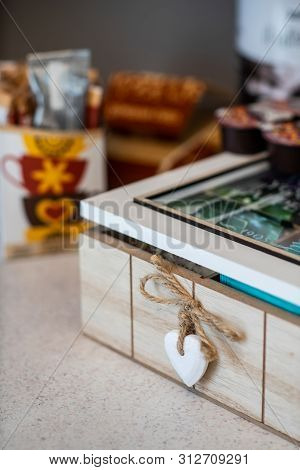 Macroshot Of Wooden Tea Box With Little Wooden Heart As Decor.
