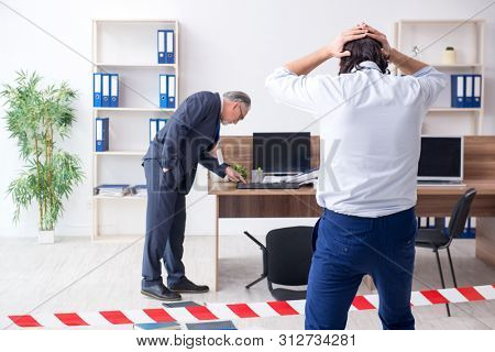 Forensic investigator investigating theft in the office