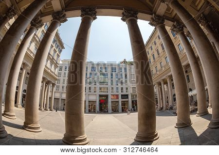 Milan, Italy-june 29,2019: View At One Part Of Corso Vittorio Emanuele Ii, Among The Columns Of Basi