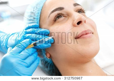 The Beautician Makes Professional Rejuvenation Vitamin Injections For The Skin Of The Patient's Face