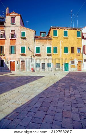 Traditional Venetian Houses And Yard Under Blue Sky, Venice, Italy