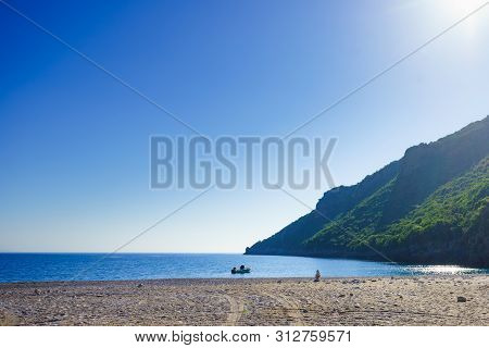 Motor Boat Anchored In Bay, Calm Blue Water. Travel Holidays Concept.