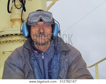 Novorossiysk, Russia - May 21, 2014: Close Portrait Of Dirty Worker, Seaman Welder, With Lively Look