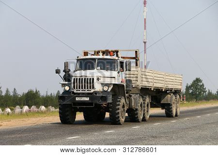 Novyy Urengoy, Russia - July 20, 2019: Offroad Semitrailer Truck Ural 44202 At The Interurban Road.