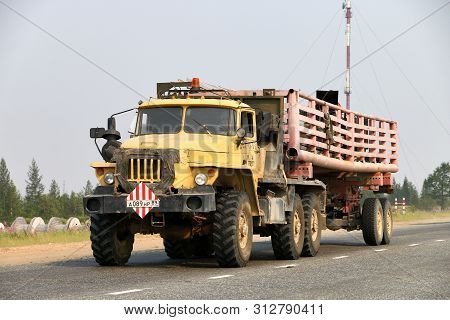 Novyy Urengoy, Russia - July 21, 2019: Offroad Semitrailer Truck Ural 44202 At The Interurban Road.