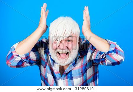 Mature Hipster Unusual Appearance. Subculture And Lifestyle. Senior Emotional Man With Long Bangs An