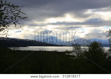 Fantastic Cloud Formations Over Lake Tornetrask In Sweden.