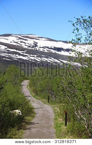 Road Leading To Mount Nuolja At Abisko In Sweden.