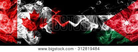 Canada Vs Jordan, Jordanian Smoky Mystic Flags Placed Side By Side. Thick Colored Silky Smoke Flags 