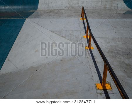 Empty Skatepark Skating, Scooters. Handrail For Tricks On A Skateboard. Outdoor Area For Extreme Spo