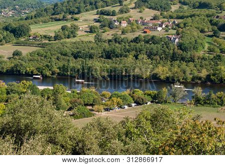 A Tourist Boats, In French Called Gabare, On The River Dordogne At La Roque-gageac, Aquitaine, Franc