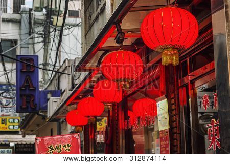 Seoul, South Korea, 12/30/2017: Street Red Light Balls. Exterior Of Cafes And Restaurants. Close-up.