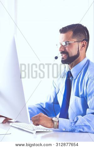Businessman In The Office On The Phone With Headset, Skype, Facetime