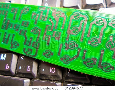 Green Electronic Board On The Keyboard. Repair Of Equipment. System Administrator.