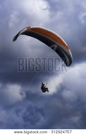 Izium, Ukraine - July 11, 2019: Paraglider On A Background Of Clouds In The Area Of ​​mount Kremenet