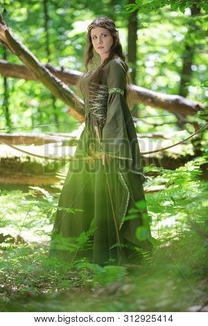 Elf Archer With A Bow In The Forest