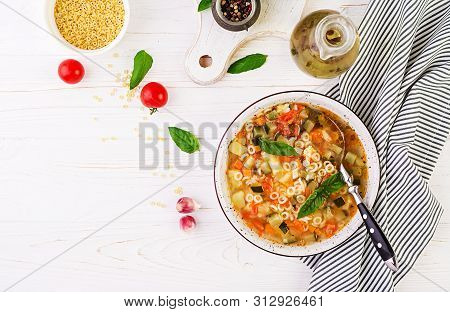 Minestrone, Italian Vegetable Soup With Pasta On White Table. Vegan Soup.  Top View